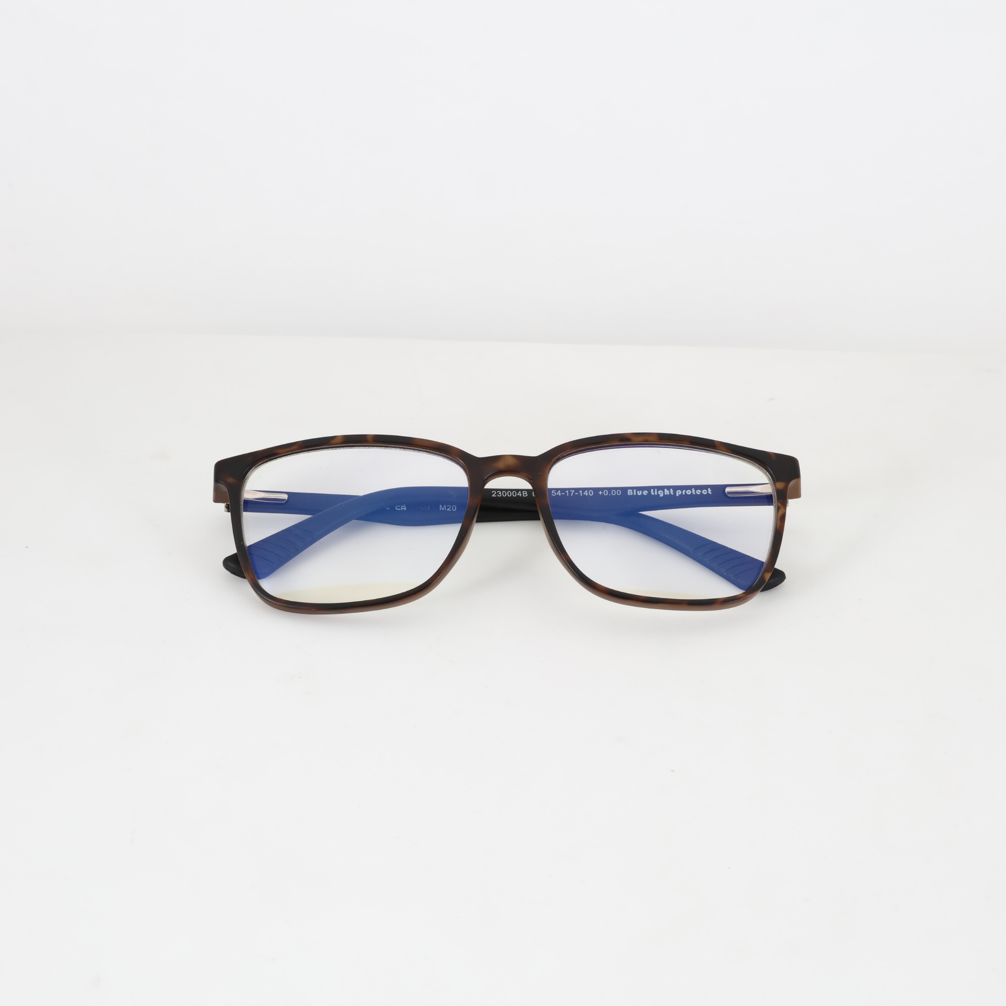 NightHaven Blaulichtfilterbrille CIRCADIA™ Havanna Braun liegend von vorne – Blaulichtfilter-Gläser mit leichtem Gelbstich, Kennzeichnung «Blue light protect»