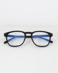 NightHaven VESPER™ Crystal Clear liegend von vorne – CE-zertifizierte Blaulichtfilterbrille mit mattschwarzem Gestell, Kennzeichnung «Blue light protect 51-20-141»